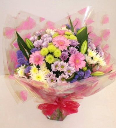 Hand Tied Bouquet - Pink - Hand tied of fresh flowers (shown in pink shades)hand crafted and arranged with complimentary cellophane and bow and presented in a gift bag.   Whether you are celebrating a birthday, anniversary, the arrival of a new baby, or perhaps you would like to help a sick friend feel better, flowers are always an excellent choice! Available for UK same day delivery if ordered by 2pm  Please note that due to the seasonal availability of flowers it may be necessary to vary individual stems from tho...