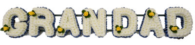 Grandad Funeral Tribute (Simple) - Grandad funeral tribute with navy ribbon, massed in double white chrysanthemums with a single large headed yellow rose in each letter. Ribbon colour and single flower colour can be changed at customer request Designed and made by Buttercups & Daisies Florist Birmingham, this Grandad Funeral Tribute (Simple) offers families a personal way to express remembrance through flowers. The design is assembled patiently, with suitable blooms and foliage positioned to maintain a clear form and balanced...