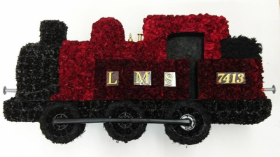 Train Tribute - Train funeral tribute Designed and made by Buttercups & Daisies Florist Birmingham, this Train Tribute offers families a personal way to express remembrance through flowers. The design is assembled patiently, with suitable blooms and foliage positioned to maintain a clear form and balanced character. Flower varieties and foliage depend on seasonal supply; suitable substitutions may therefore be used while preserving the overall style, value and colour character shown. The team can help with ...