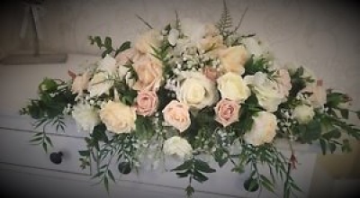 Top Table Arrangement - Mixed rose and gypsophila top table arrangement Designed with wedding styling in mind, this Top Table Arrangement is arranged locally in Birmingham with careful attention to presentation. The team considers venue style, photography, seasonal colour and surrounding décor when discussing a coordinated design. Because fresh flowers naturally change through the year, particular varieties may be substituted with comparable choices that retain the intended palette and shape. A consultation can co...