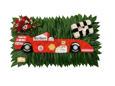 Racing Car - Pay tribute to their love of racing cars with this distinctive floral display. The racing car is covered in a bed of fresh white double spray chrysanthemums with red and black spray colours. on a bed of cococlus leaves finished with a red rose spray Our experienced Birmingham florists create this Racing Car with a respectful finish suitable for a funeral, commemoration or celebration of life. Every section is constructed with attention to symmetry, visual depth and neat edging, helping the t...