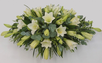 Longiflorum white lily spray - Coffin spray in white longiflorum lilies with eucalyptus and other floiage (Standard) approx 95cm x 50cm, 3ft x 1.75ft (shown)Also available in (Deluxe) approx 120cm x 60cm, 4ft x 2ft, and (Luxury) approx 150cm x 75cm, 5ft x 2.5ft. Please note that a minimum of 7 days notice is required for lily sprays This Longiflorum white lily spray is carefully handcrafted in Birmingham for a meaningful farewell, memorial gathering or funeral service. The florists consider proportion, outline, colour bal...