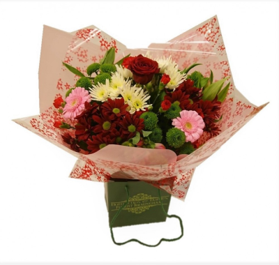 Everlasting love Hand-tied - This beautiful hand-tied bouquet includes a single fragrant red naomi rose and a mixture of flowers in pink, red, whites and green. a special gift for your Valentine Made by an experienced Birmingham florist, this Everlasting love Hand-tied offers a personal alternative to a generic postal flower delivery. Complementary flowers and foliage are selected to give the arrangement attractive movement, depth and a well-finished presentation. Because fresh flowers naturally change through the year,...