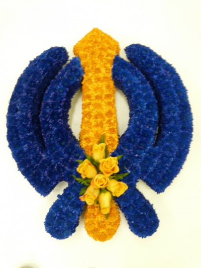 Khanda Funeral Tribute - The Khanda Sikh religious funeral tribute is created on a 2ft x 2ft frame using dyed and yellow double chrysanthemums and a yellow rose spray by our skilled florists at Buttercups & Daisies Florists Birmingham Designed and made by Buttercups & Daisies Florist Birmingham, this Khanda Funeral Tribute offers families a personal way to express remembrance through flowers. The design is assembled patiently, with suitable blooms and foliage positioned to maintain a clear form and balanced characte...