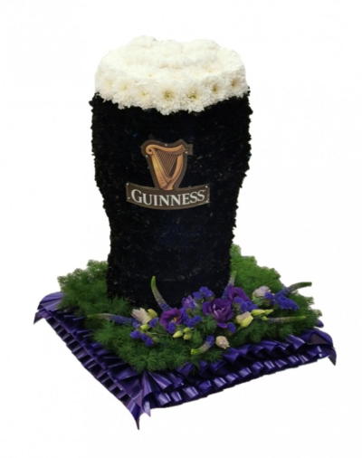 Guinness pint funeral tribute - This 3D Guinness Pint is crafted by our skilled florists at Buttercups & Daisies Florists Birmingham This tribute stands approx 14in/35cm high Designed and made by Buttercups & Daisies Florist Birmingham, this Guinness pint funeral tribute offers families a personal way to express remembrance through flowers. The design is assembled patiently, with suitable blooms and foliage positioned to maintain a clear form and balanced character. Flower varieties and foliage depend on seasonal supply; s...