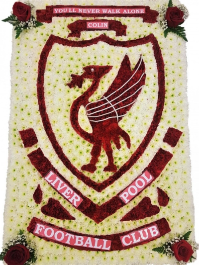 Liverpool FC Badge - Liverpool football club badge floral tributeapprox 24 x 36 inches 60 x 90 cm Handcrafted by Buttercups & Daisies Florist Birmingham, this Liverpool FC Badge is prepared as a thoughtful floral tribute for a funeral, memorial or remembrance service. Shape, scale, contrasting tones and finishing details are assessed closely to create an appropriate and respectful presentation. Seasonal availability can affect individual stems, but the florist will protect the designs principal colours, proporti...