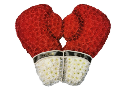 Boxing Gloves Funeral Tribute - Boxing gloves funeral tribute, creating using sprayed double chrysanthemums. Names/personalisation on request Our experienced Birmingham florists create this Boxing Gloves Funeral Tribute with a respectful finish suitable for a funeral, commemoration or celebration of life. Every section is constructed with attention to symmetry, visual depth and neat edging, helping the tribute look considered from different viewpoints. Fresh materials are selected according to quality and supply, with thou...