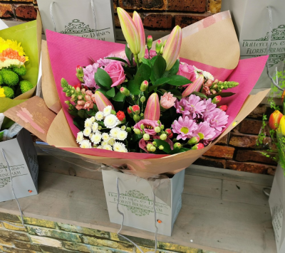 Pink Hand-Tied Bouquet - Pink Hand-Tied Bouquet is a beautiful florist choice arrangement designed in soft pink shades using a selection of the freshest mixed flowers available on the day. This bouquet is ideal for birthdays, thank you gifts, congratulations, get well soon flowers, new baby gifts or simply sending something pretty and thoughtful. Each bouquet is professionally arranged by our Birmingham florist team in a hand-tied style and finished with florist-style wrapping. Flower varieties may vary depending on...