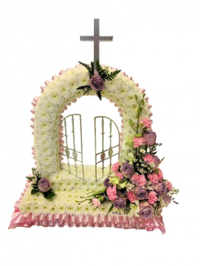 Gates of Heaven - This beautiful gates of heaven design is shown here in pinks and mauves to suit a lady but can be made in different colours as per your request. Approx 56 x 37 cm Our experienced Birmingham florists create this Gates of Heaven with a respectful finish suitable for a funeral, commemoration or celebration of life. Every section is constructed with attention to symmetry, visual depth and neat edging, helping the tribute look considered from different viewpoints. Fresh materials are selected acc...