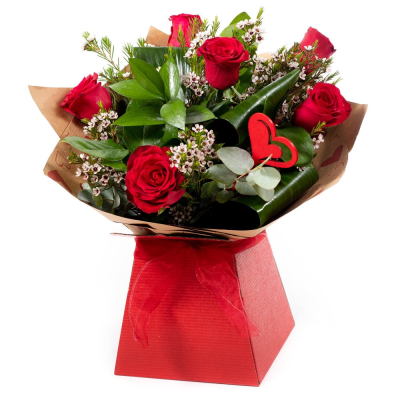 Kissing Booth - Who could resist you after receiving this selection of the beautiful red roses matched to the finest seasonal foliage. Made by an experienced Birmingham florist, this Kissing Booth offers a personal alternative to a generic postal flower delivery. Complementary flowers and foliage are selected to give the arrangement attractive movement, depth and a well-finished presentation. Because fresh flowers naturally change through the year, particular varieties may be substituted with comparable cho...