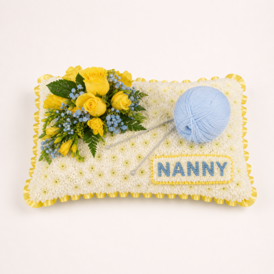 Knitting Cushion Tribute - A thoughtful knitting-themed funeral cushion created for someone who loved wool, needles, crafting or handmade projects.