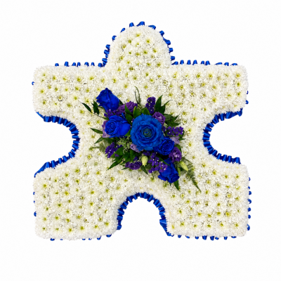 Jigsaw Puzzle Piece Tribute - Puzzle Piece Tribute is a distinctive funeral flower design created in the shape of a single jigsaw piece.