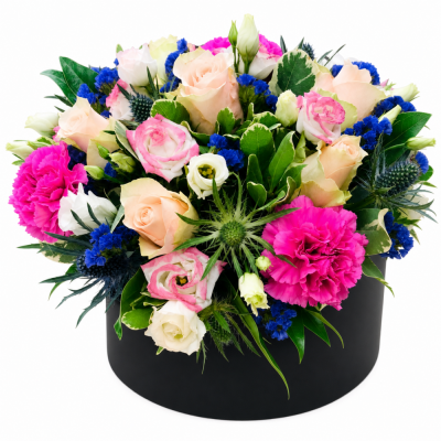 Bright Pink & Blue Hatbox - Bright Pink & Blue Hatbox brings together bright pink roses, blue hydrangea-style blooms, vivid seasonal flowers and fresh foliage arranged in a round hatbox.